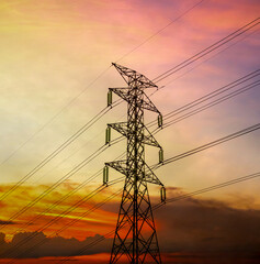 High voltage electric pole station on sunset background,  hight power grid line energy tower transmission network pold voltage substation, plant construction building technology industy energy.