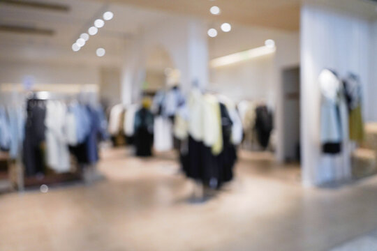 Abstract blur clothing boutique display interior of shopping mall background. blurred image background with clothing store.