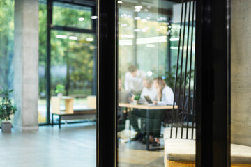 Business office with blurred people casual wear, with blurred bokeh background.