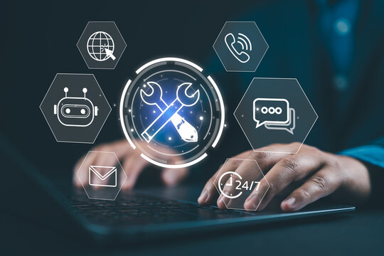 IT support and digital tools concept. Person using laptop with glowing wrench and screwdriver, representing system maintenance, tech service, customer support, and online troubleshooting in business