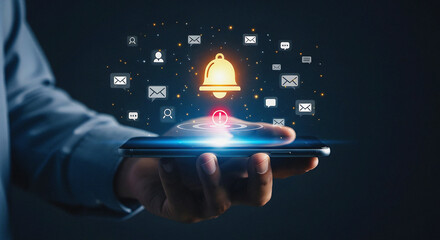 Hand Holding Smartphone with Glowing Notification Bell and Floating Digital Icons for Social Media and Email Alert System