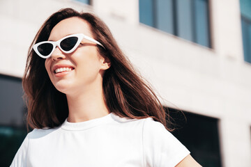 Young beautiful smiling hipster woman in trendy summer white t-shirt clothes. Sexy carefree model...