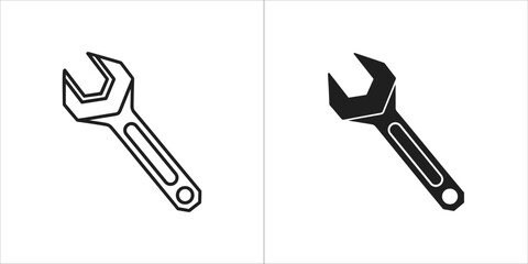 Line art and solid black silhouette of a wrench