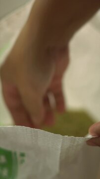 close up of hand open bag of milk stage rice or young rice milk is a powerhouse of fiber, b vitamins, and essential minerals. it's easily digestible, subtly sweet, and packed with health benefits.