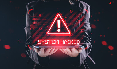 System hacked warning sign with glowing red alert icon above tablet held by person in dark suit on digital binary background in cyber attack concept.
