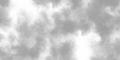 A dramatic black and white abstract background features dark clouds in a smoky atmosphere