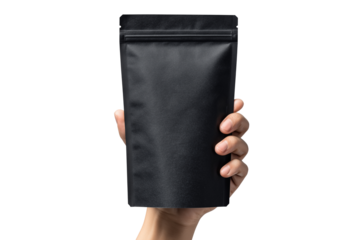 Hand holding black resealable pouch of coffee beans isolated on transparent background