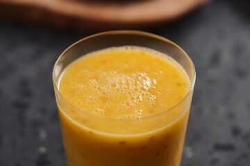 Fresh mango lulo smoothie on kitchen countertop