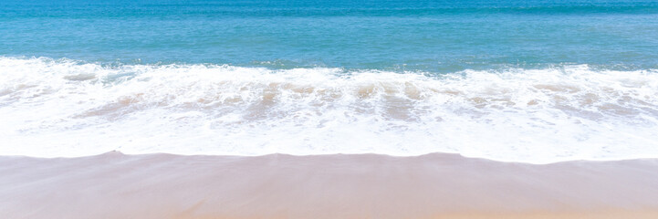 Deep blue sea with whitecap of wave into the coast at the beach and blue sky whit thin fluffy clouds in the distance taken at the sea in Phuket used as blue natural background texture
