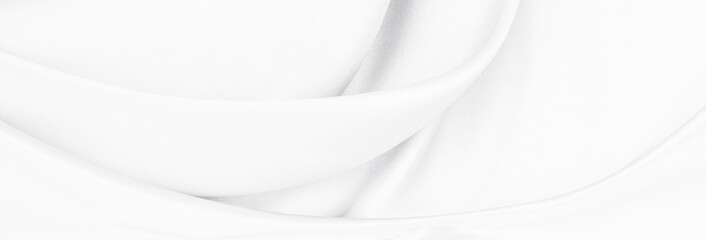 White gray satin texture that is white silver fabric silk panorama background with beautiful soft blur pattern natural.