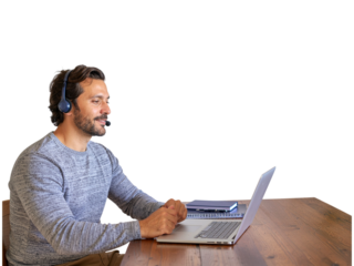 Smiling man works at desk with laptop and headphones on transparent background