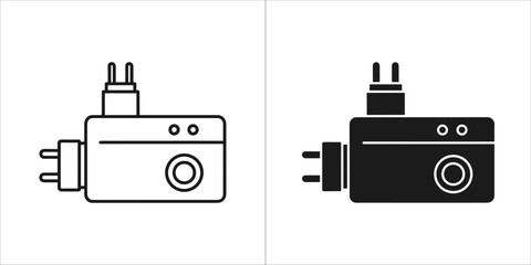 Obraz premium Two universal travel adapter plugs, one outline and one solid black