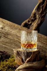 Whiskey on an old wooden stump.