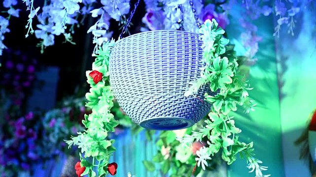 Vibrant garlands in various colors, hang beautifully as traditional Indian wedding decorations, creating a festive floral backdrop for celebration and temple entrance adornment.