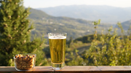 Pint of Beer and Peanuts Outdoors