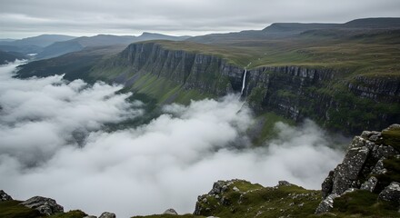 Misty Mountain Landscape with Waterfall and Rolling Clouds