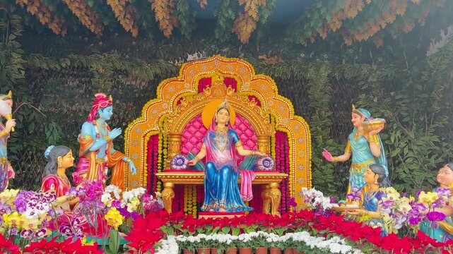 Beautiful Hindu Goddess Radha Idol Seated on Golden Throne with Garland