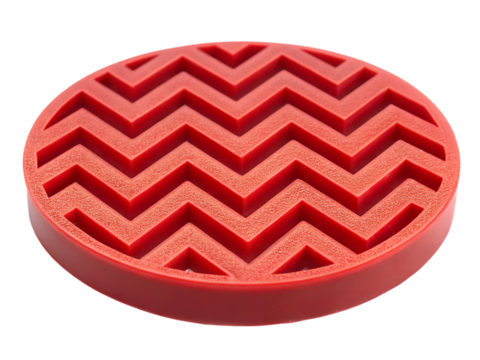 Red rubber coaster with zigzag pattern isolated on transparent background