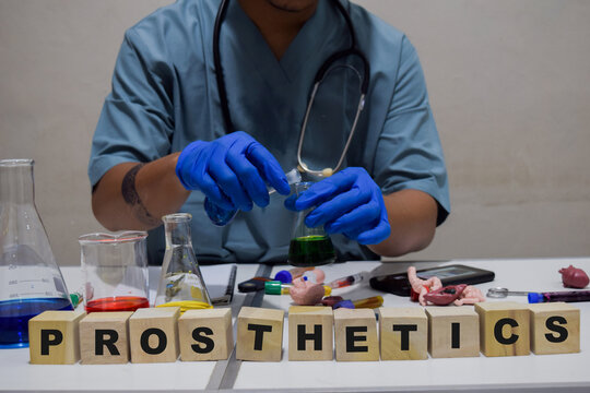 A healthcare professional analyzing a detailed prosthetics in a lab. scientific research concept