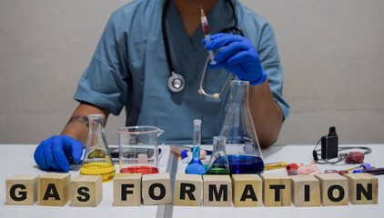 A healthcare professional conducts an innovative gas formation experiment in a lab. scientific...