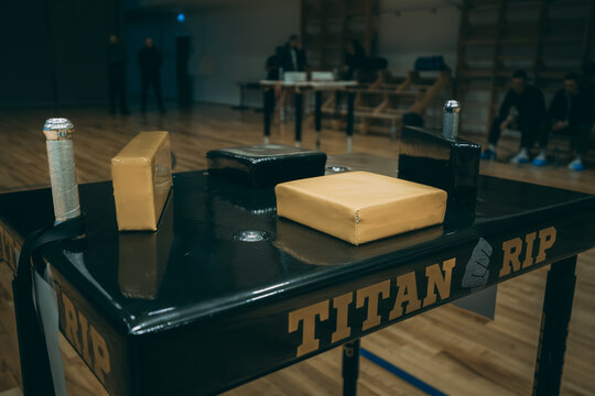 A professional arm wrestling table stands ready in a gymnasium, its pads and grips set up for the next match. 10.25. 2025 Valmiera, Latvia