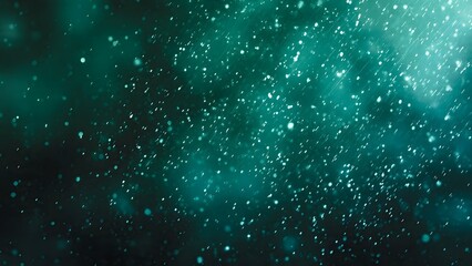 Abstract background with falling snowflakes and sparkling particles in shades of teal and blue