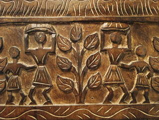 wooden men carved into the panel