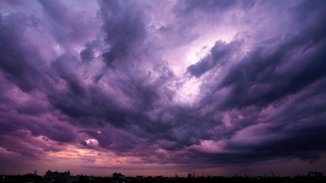 midgard. Dark purple storm clouds gathering before rainfall, dramatic sky formation, natural weather phenomenon. travel magazines, destination branding, designed for travel destination branding.