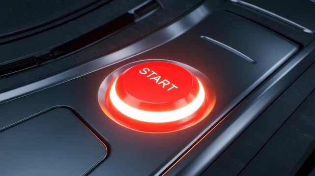 Bright red start button on modern control panel signaling the beginning of an important task or process