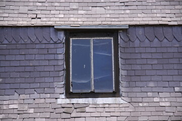 Old Window in Brick Wall
Weathered window framed by aged, cracked, and neglected bricks.
