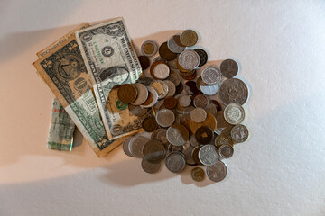 A pile of coins and a dollar bill