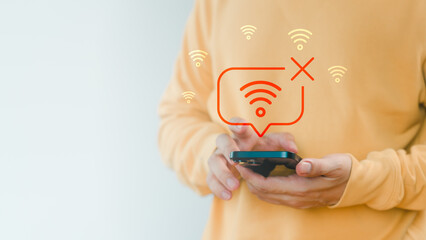 Man holding a smartphone with no Wi-Fi connection icon, symbolizing internet disconnection, network error, or poor signal, connectivity issues, technology problem, and online failure concept.