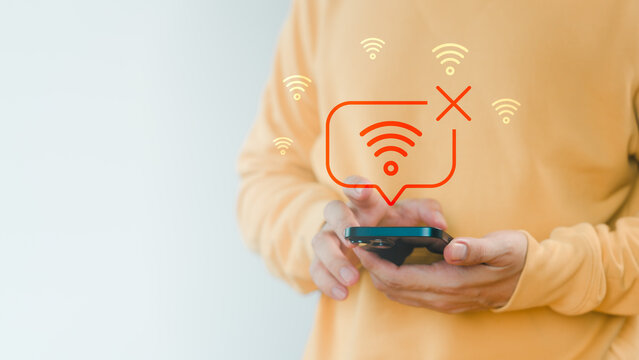 Man holding a smartphone with no Wi-Fi connection icon, symbolizing internet disconnection, network error, or poor signal, connectivity issues, technology problem, and online failure concept.