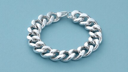 Elegant Silver Chain Bracelet Isolated on Soft Blue Background for Jewelry Collection or Fashion Accessory Display