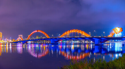 Illuminated dragon bridge at night over han river in Da nang, Vietnam