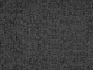 Uniformed rows of graphite and onyx ripple across this textured ebony veneer, echoing the precision of modern design