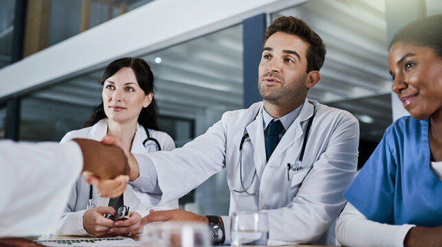 Recruitment, doctors and shaking hands in hospital with interview, communication and collaboration. Meeting, medical people and handshake with contract, deal and success in agreement for job offer