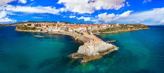 Italy , Tuscany tourism scenic places and coastal towns - charming Piombino in Livorno province. aerial drone panoramic view with lighthouse and old town