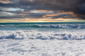 the waves of the rough sea and the clouds anticipate the arrival of the storm