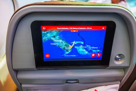 Close up view of flight map on screen built into airplane seatback showing route over Florida and the Bahamas. USA. Miami. 