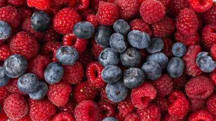 Raspberry, blueberry as a background.