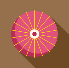 Traditional pink asian umbrella with yellow ribs creating a long shadow on a brown background, viewed from above
