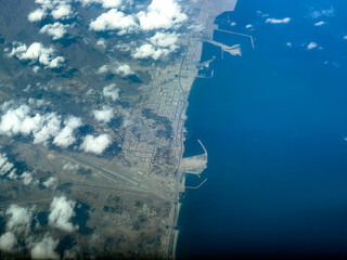 aerial landscape view of coastline in Fujairah, located at Gulf of Oman, with Fujairah International Airport (IATA: FJR, ICAO: OMFJ) and Port of Fujairah, Fujairah Oil Industry Zone, Banana Island
