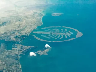 Fototapete Palme Aerial landscape view of the coastline of Dubai with Canal District - United Arab Emirates - aerial photograph of the Palm Jebel Ali only sparsely built-up  © Mario Hagen