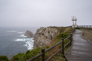 Lighthouse of Peña seascape on a rainy day. Gozón. Asturias. Spain