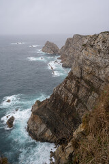 Lighthouse of Peña seascape on a rainy day. Gozón. Asturias. Spain