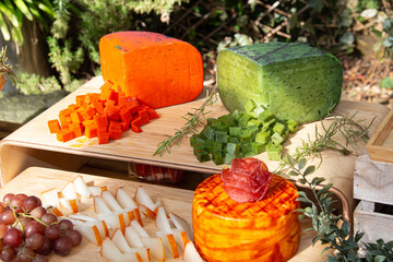 Colorful cheese board offering gourmet appetizers outdoors