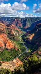 Naklejka premium Scenic canyon with colorful rock formations under a bright blue sky