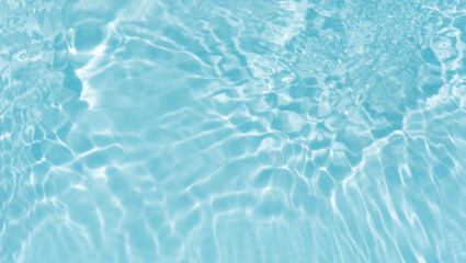 Blue water with ripples on the surface. Defocus blurred transparent blue colored clear calm water...