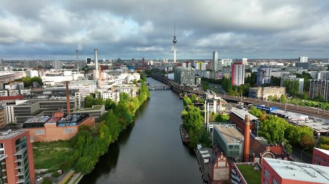City of Berlin, Germany from above.Aerial view of cityscape showing architectural landmarks Fernsehturm TV Tower and Berlin Cathedral by day. Drone Flight past Alexanderplatz TV Tower, Sunflairs circa